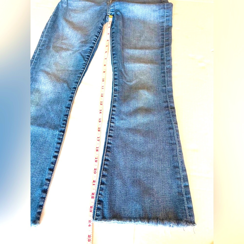 7 for All Mankind straight, raw hem jeans with slight kick.